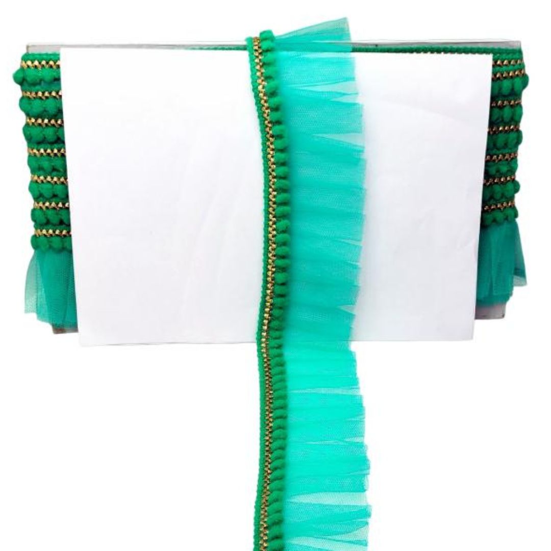 Green fabric with gold trim on a white background