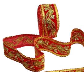 Red ribbon with gold embroidery on a white background