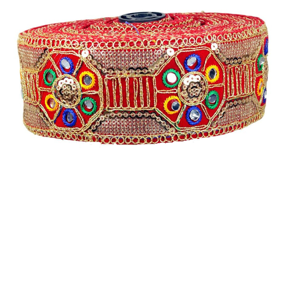 Decorative headband with colorful gemstones on a white stand