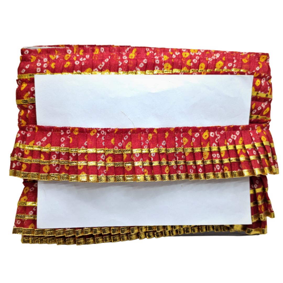 Decorative cornice with red and gold floral pattern on a white background