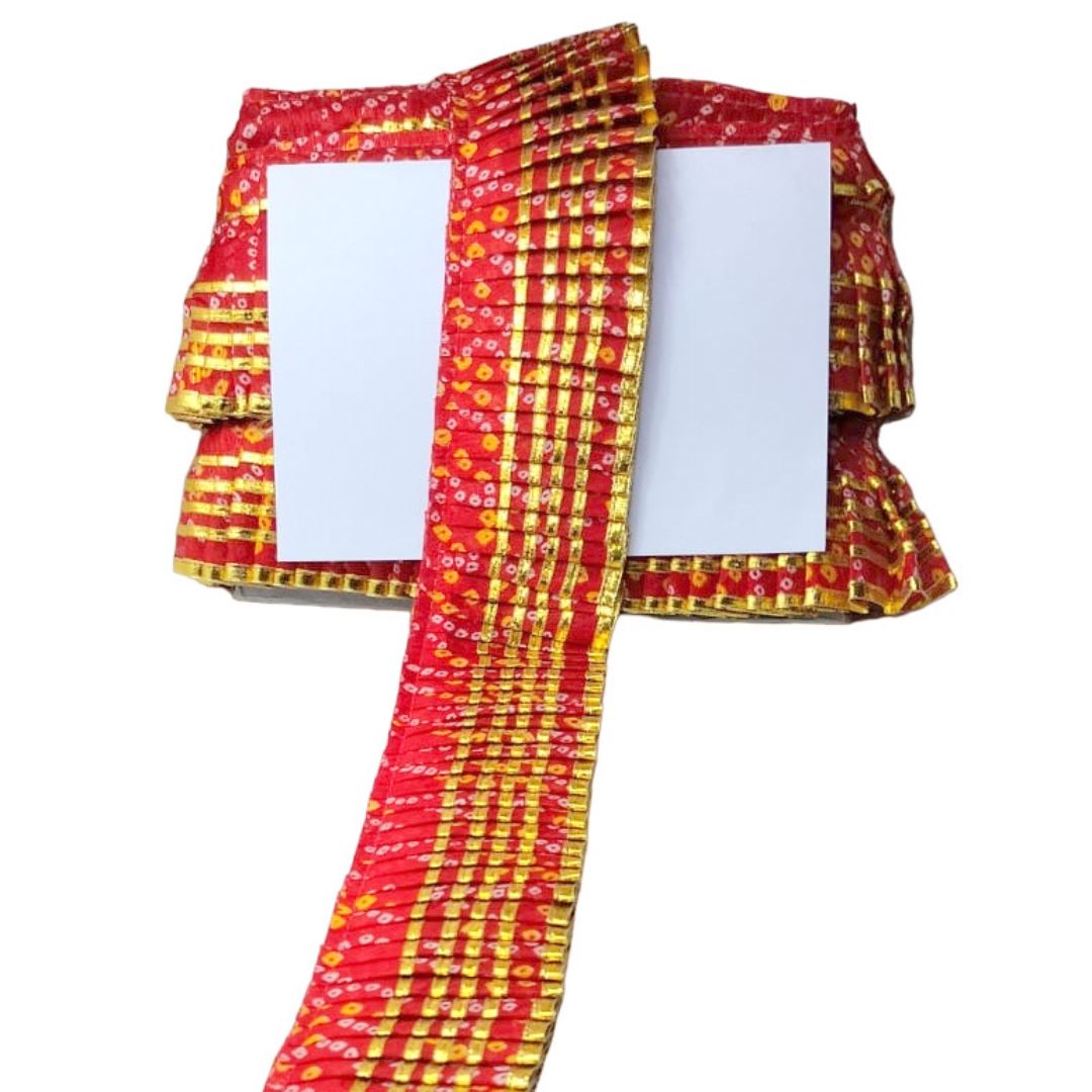 Red and yellow patterned fabric on a white background
