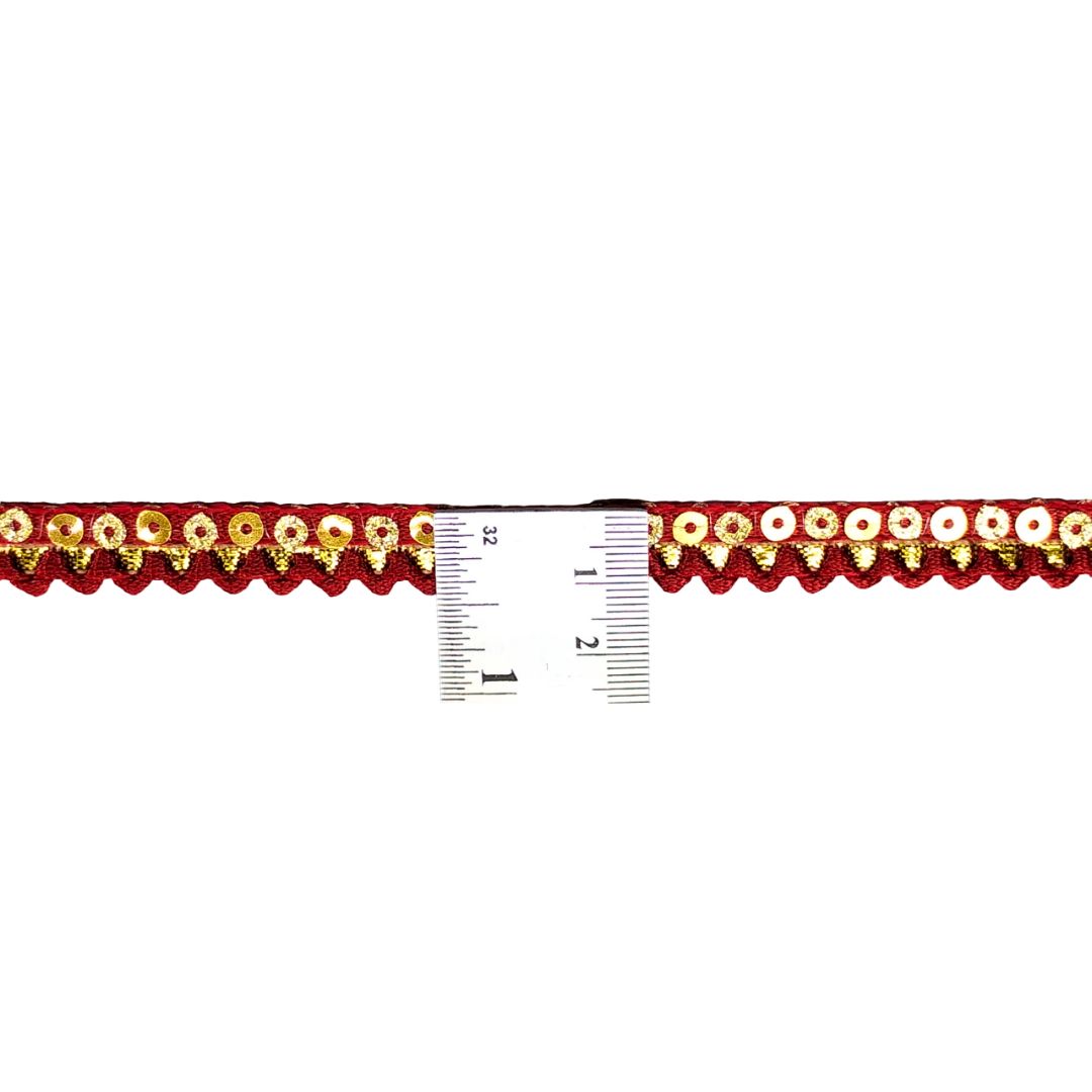 Decorative trim with gold and red flowers on a white background