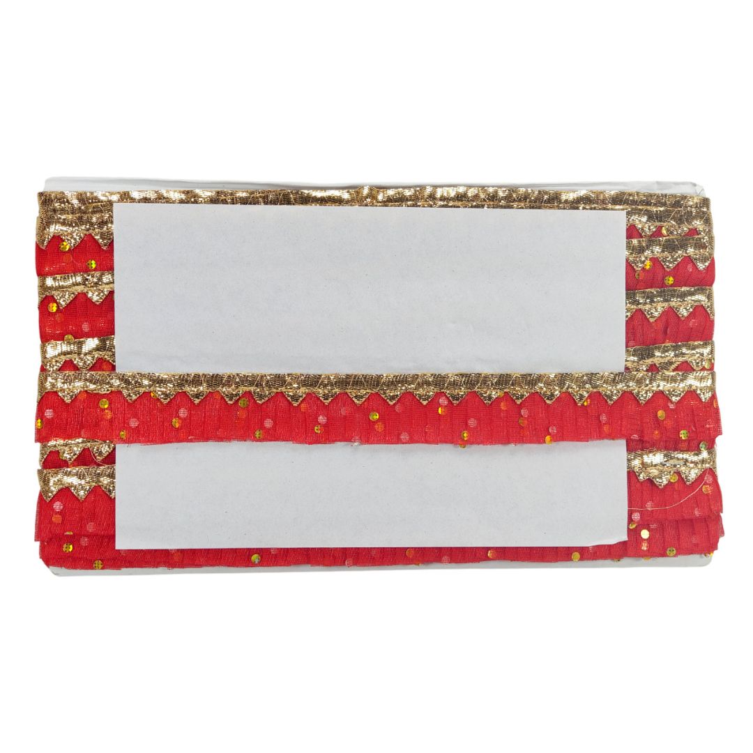 Red and gold clutch bag with white center on a white background