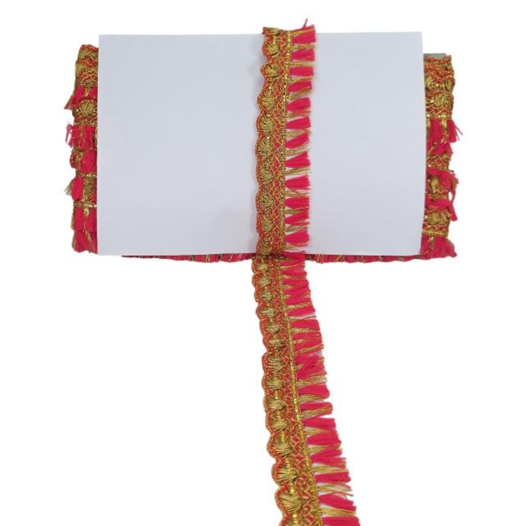 Decorative ribbon with red and gold fringes on a white background