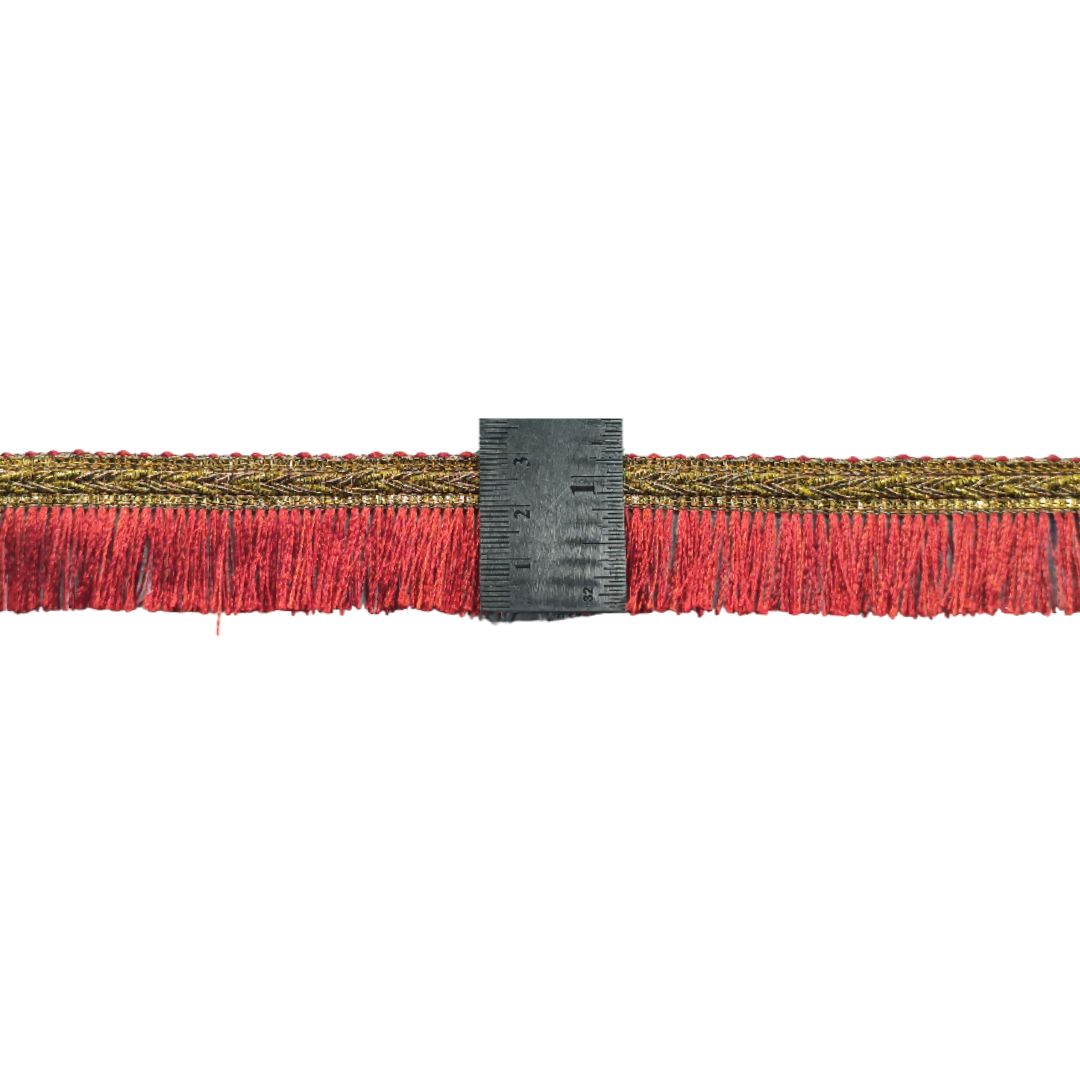 Textile strip with red fringe and a measuring tool on a white background