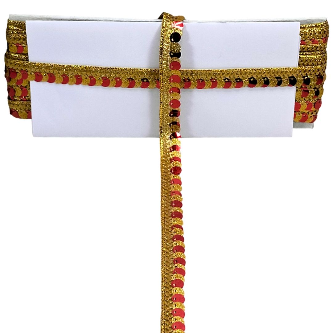 White clutch with gold and red decorative band on a white background