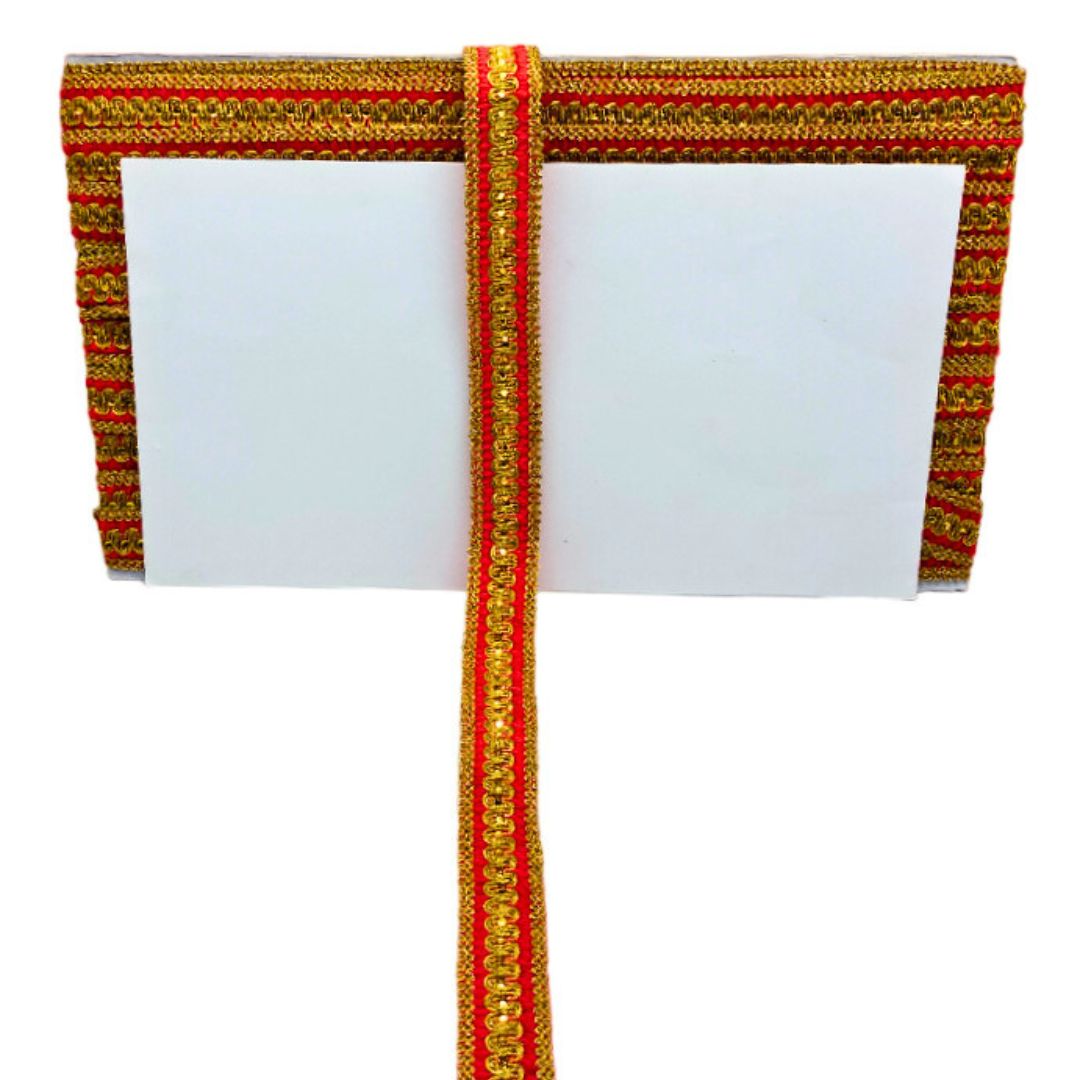 Decorative ribbon with gold and red pattern on a white background