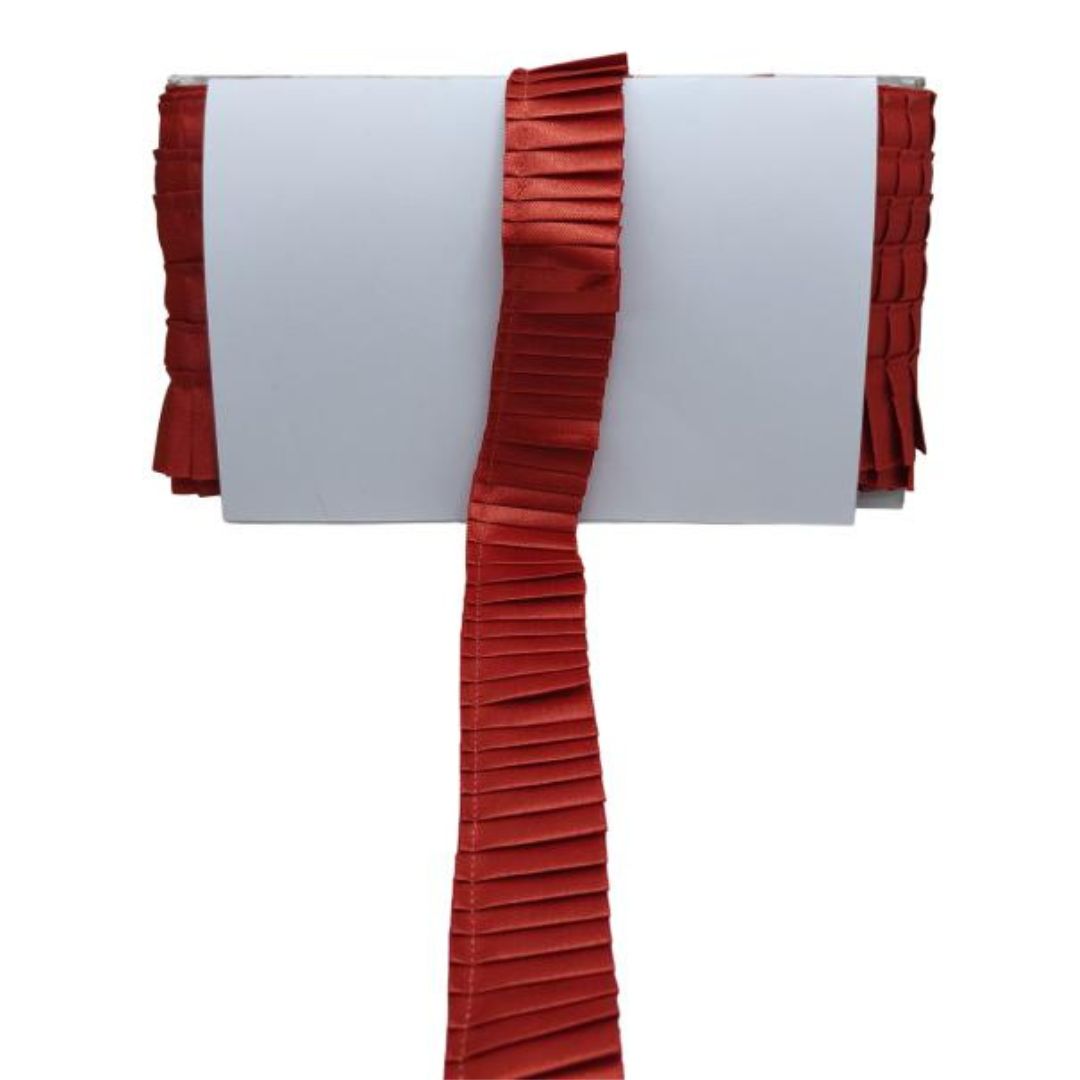 Red pleated ribbon on a white background