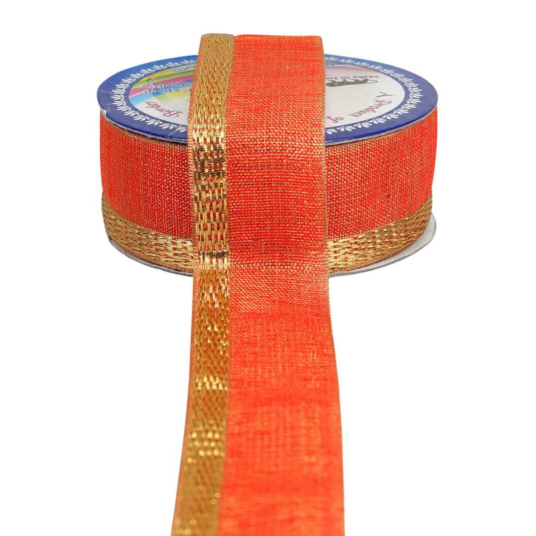 Spool of orange mesh ribbon with gold edge on a white background