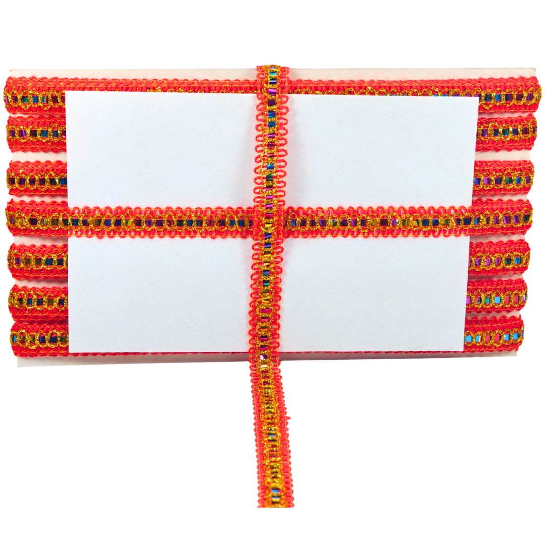 Decorative red ribbon with colorful beads on a white background