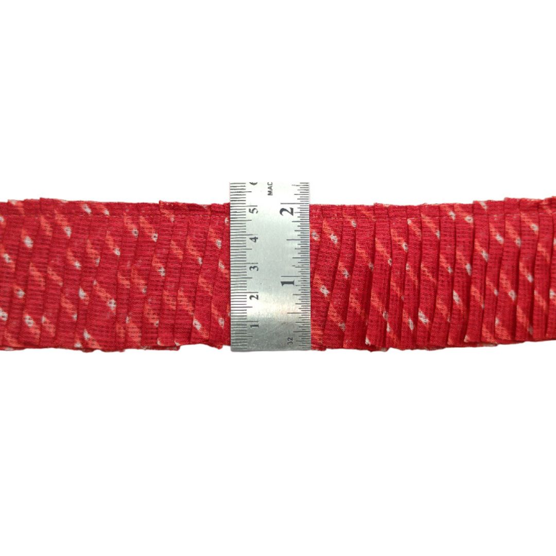 Red woven belt with a silver measuring tape on a white background