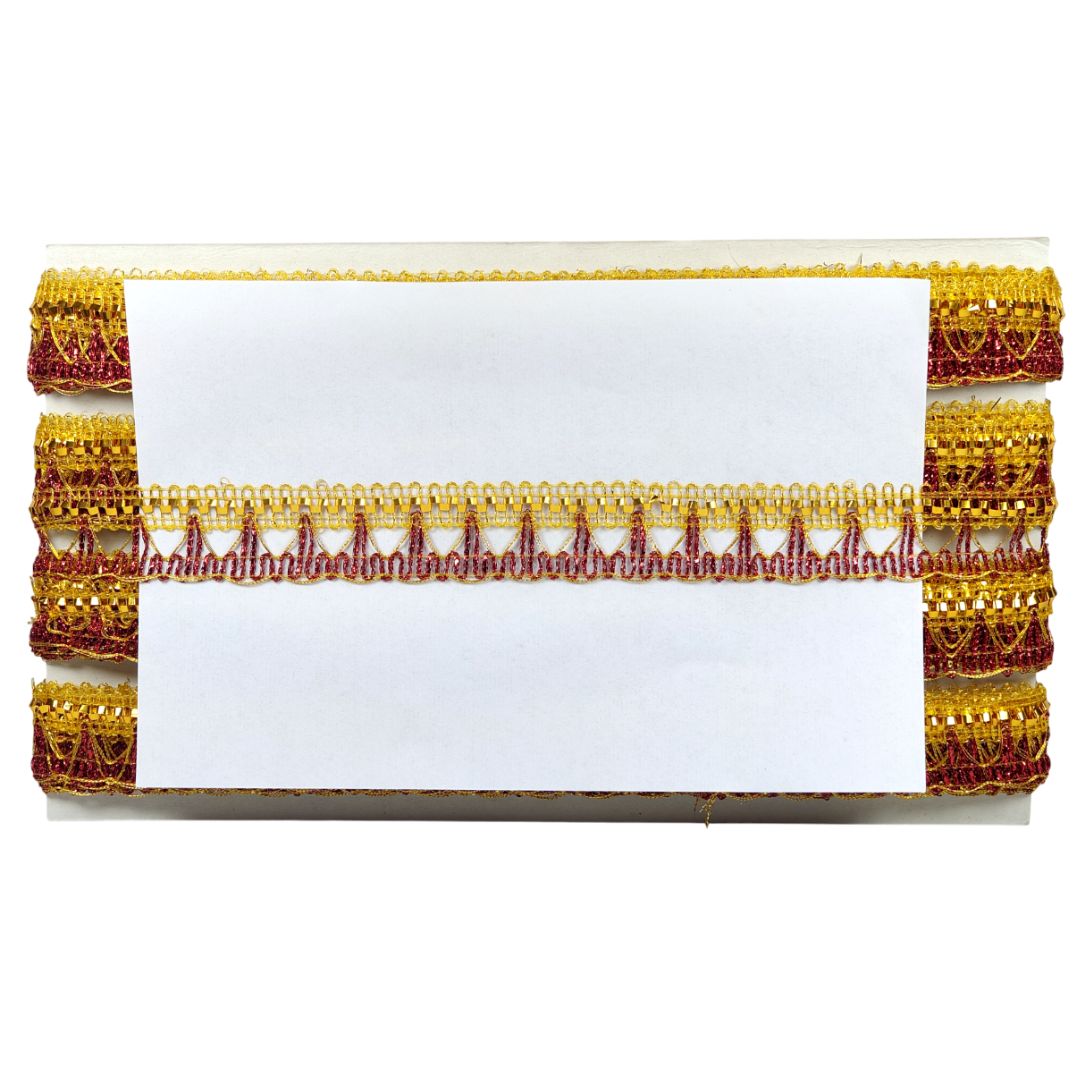 Decorative ribbon with gold and red patterns on a white background