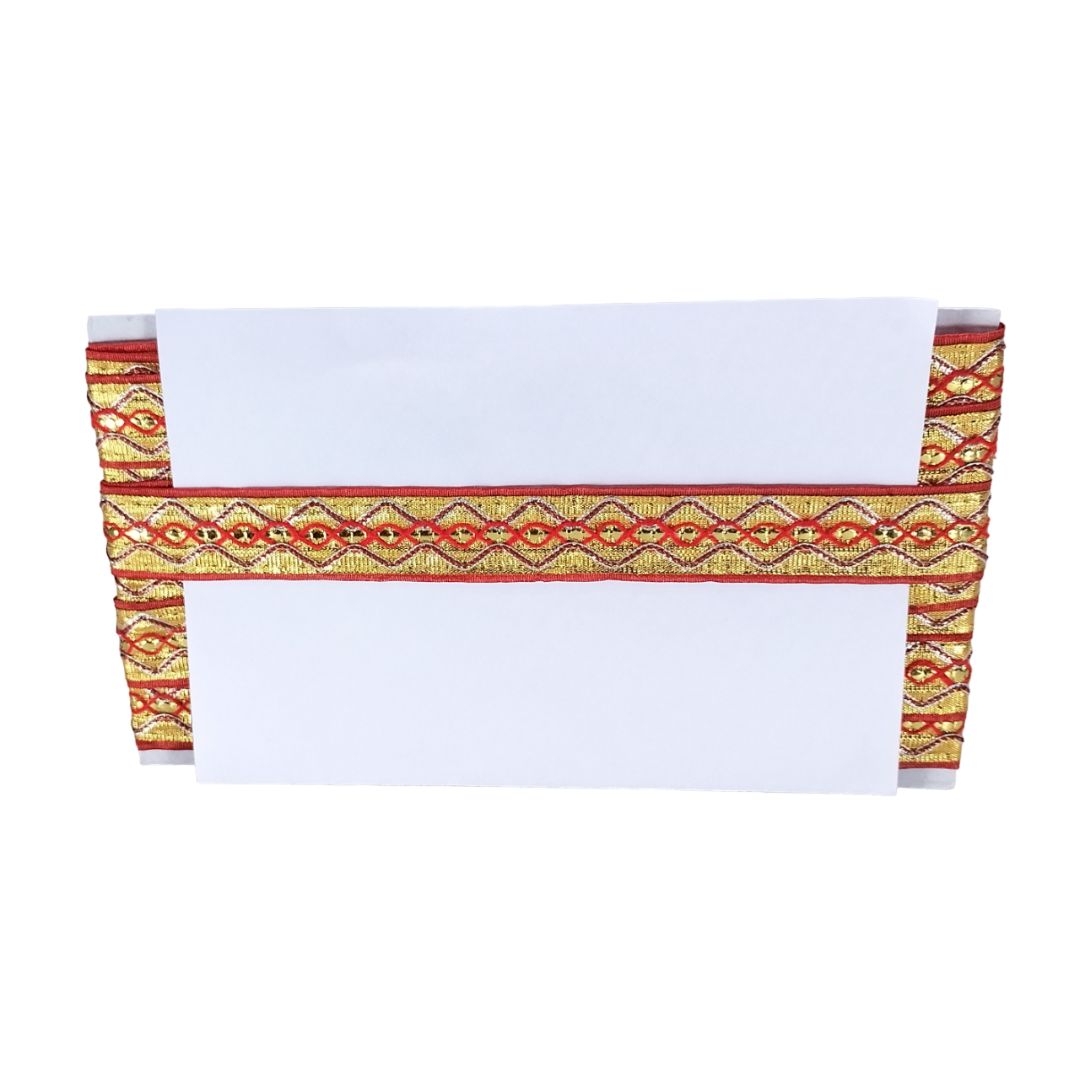 White table runner with red and yellow geometric pattern on a white background