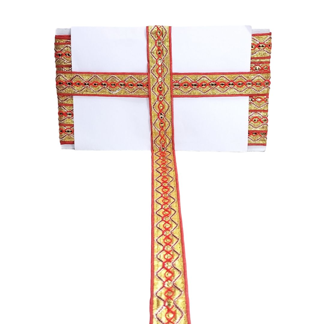 Decorative headband with red and gold patterns on a white background
