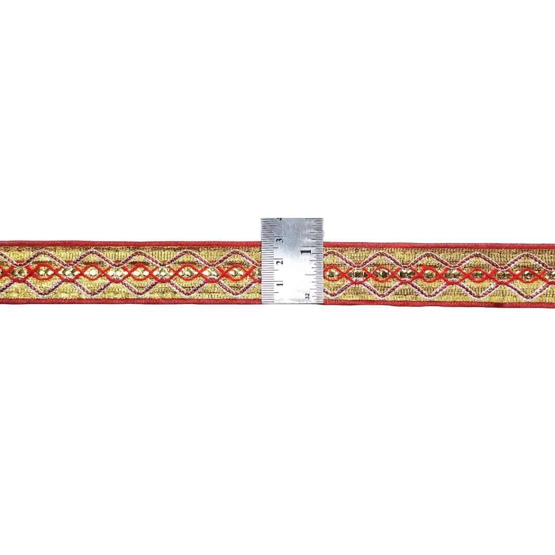 Decorative ribbon with a geometric pattern and a ruler for scale on a white background