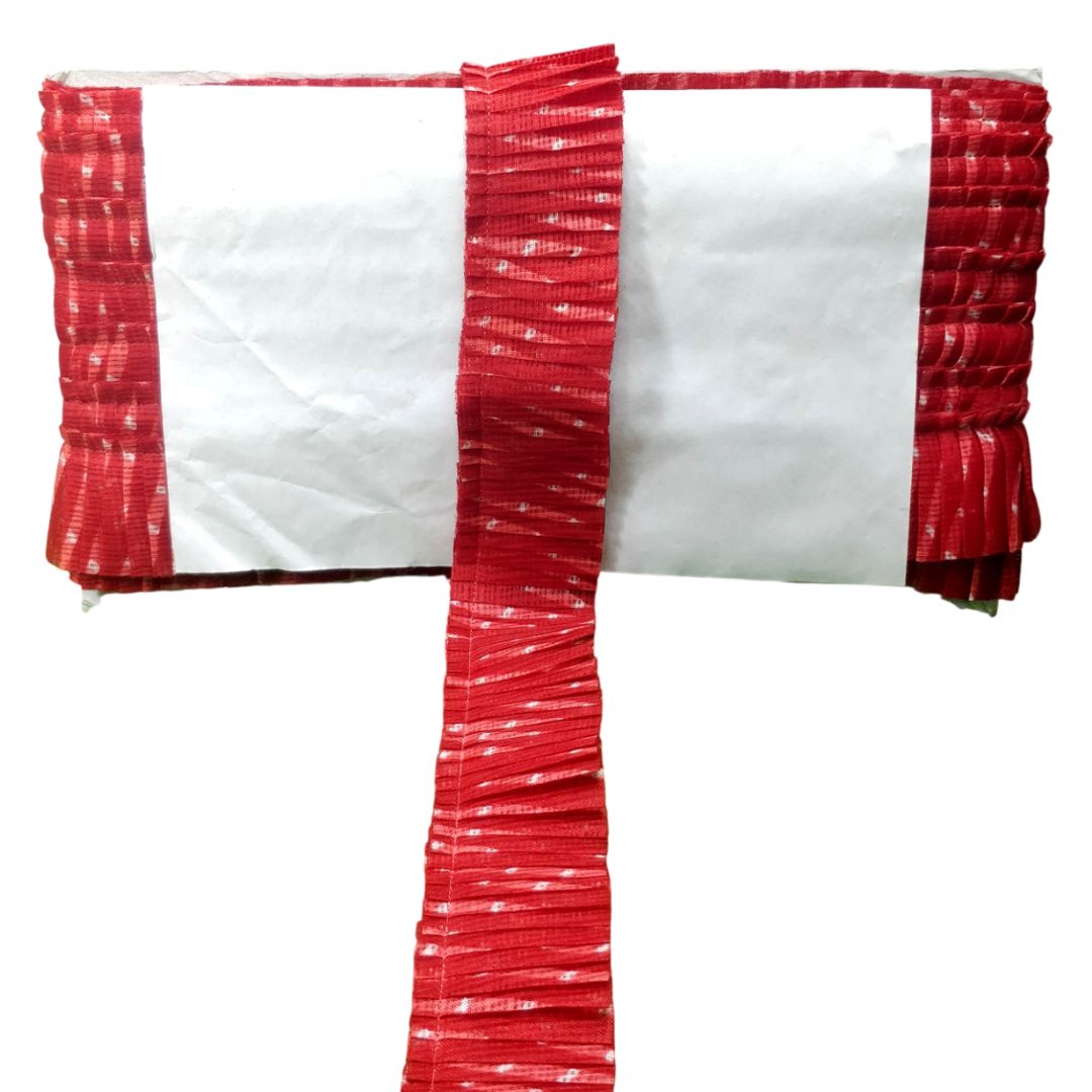 Red and white striped pillow on a white background