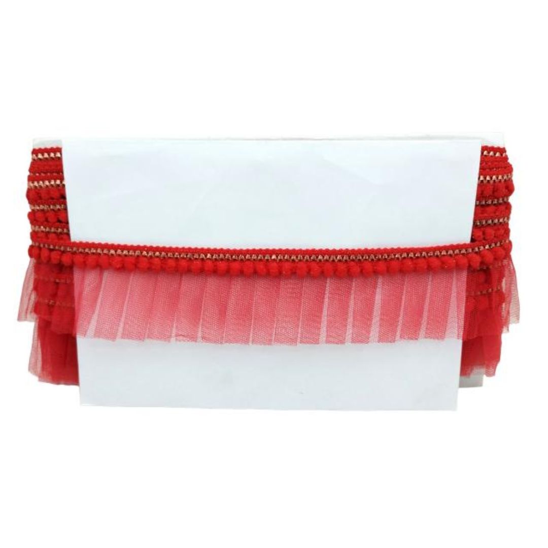 White clutch with red tulle and decorative trim on a white background