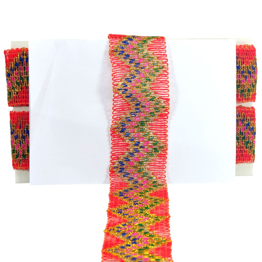 Colorful woven bracelet with a zigzag pattern on a white background