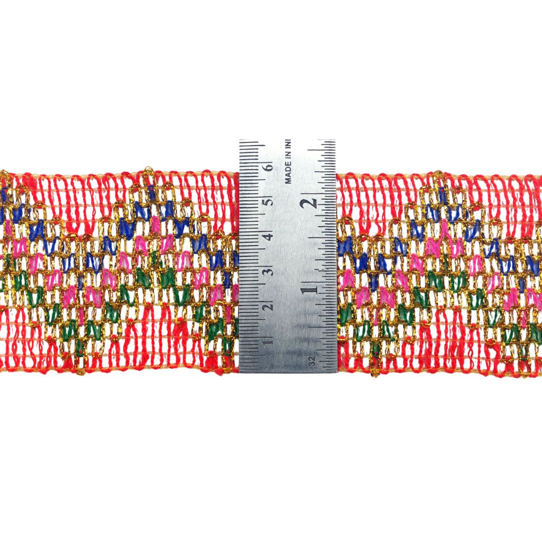 Multicolored woven ribbon with a ruler for scale on a white background