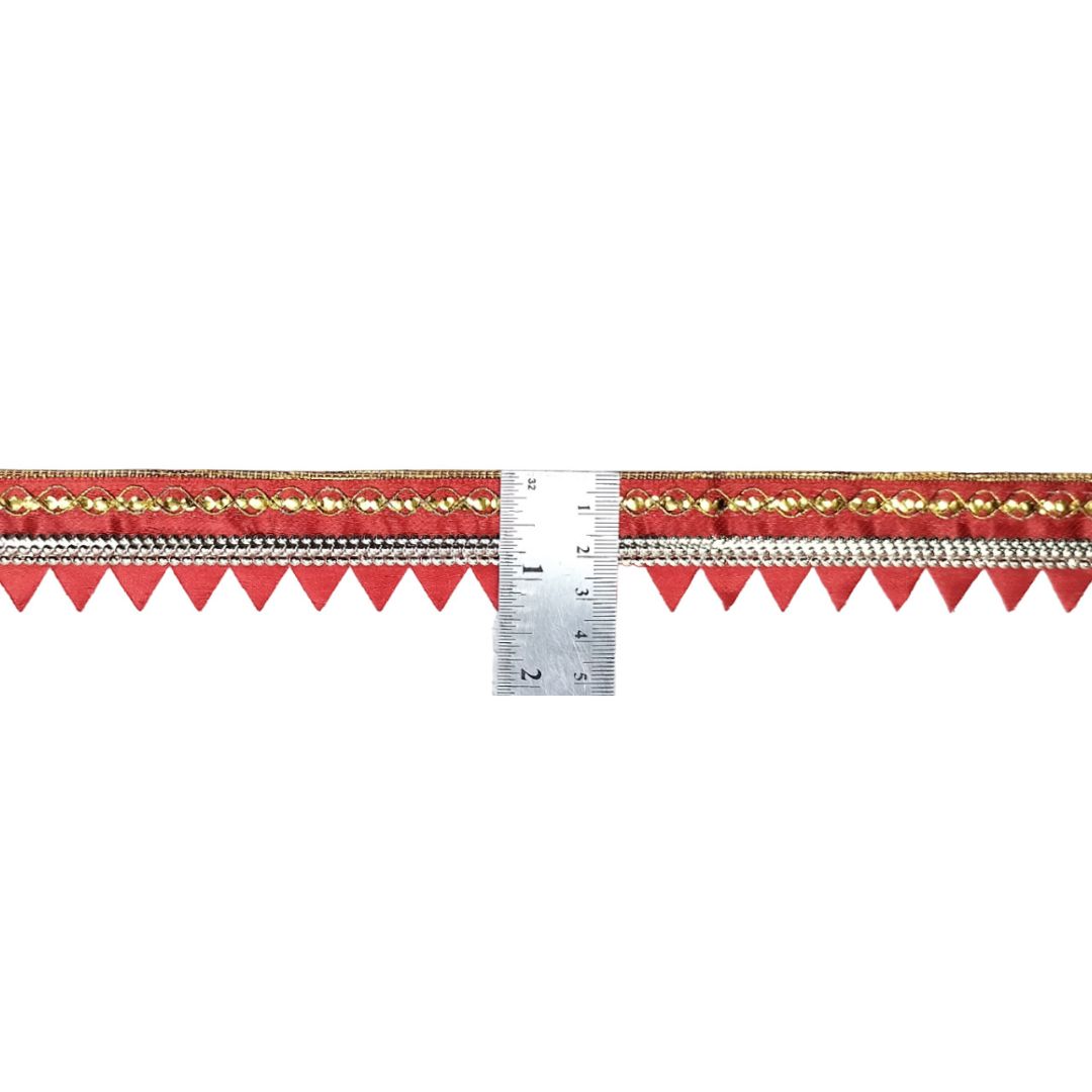 Decorative ribbon with red triangle flags and gold accents, measured against a ruler on a white background.