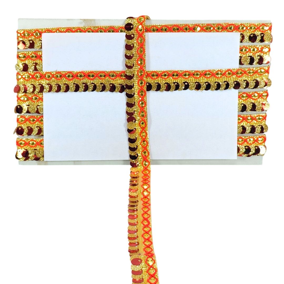 Decorative card with gold, orange, and black patterns on a white background