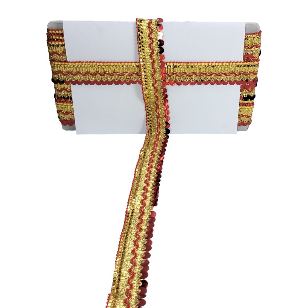 Decorative ribbon with gold and red patterns on a white background