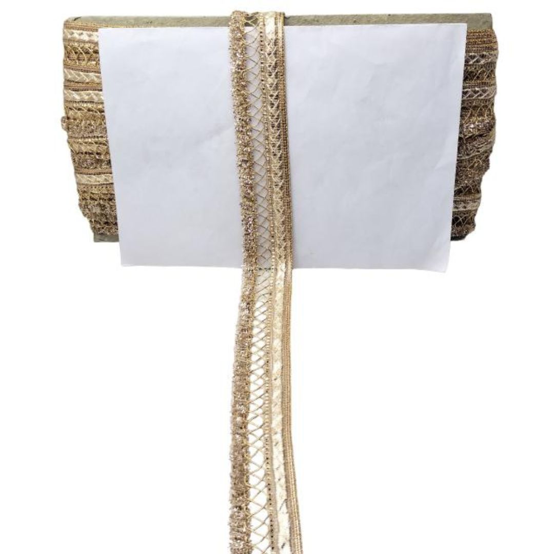 White napkin with gold trim on a white background