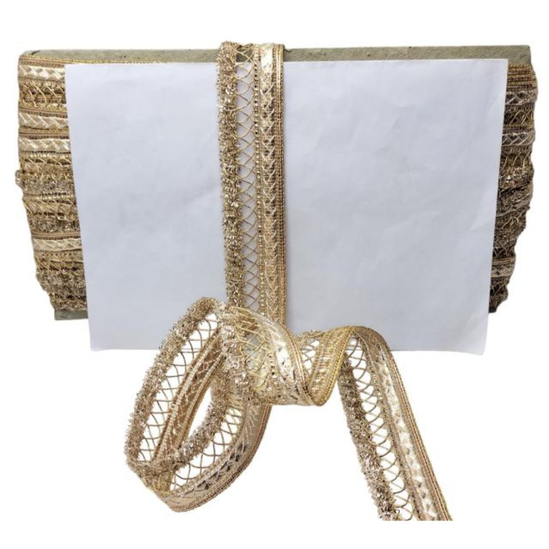 Gold ribbon with decorative loops on a white background