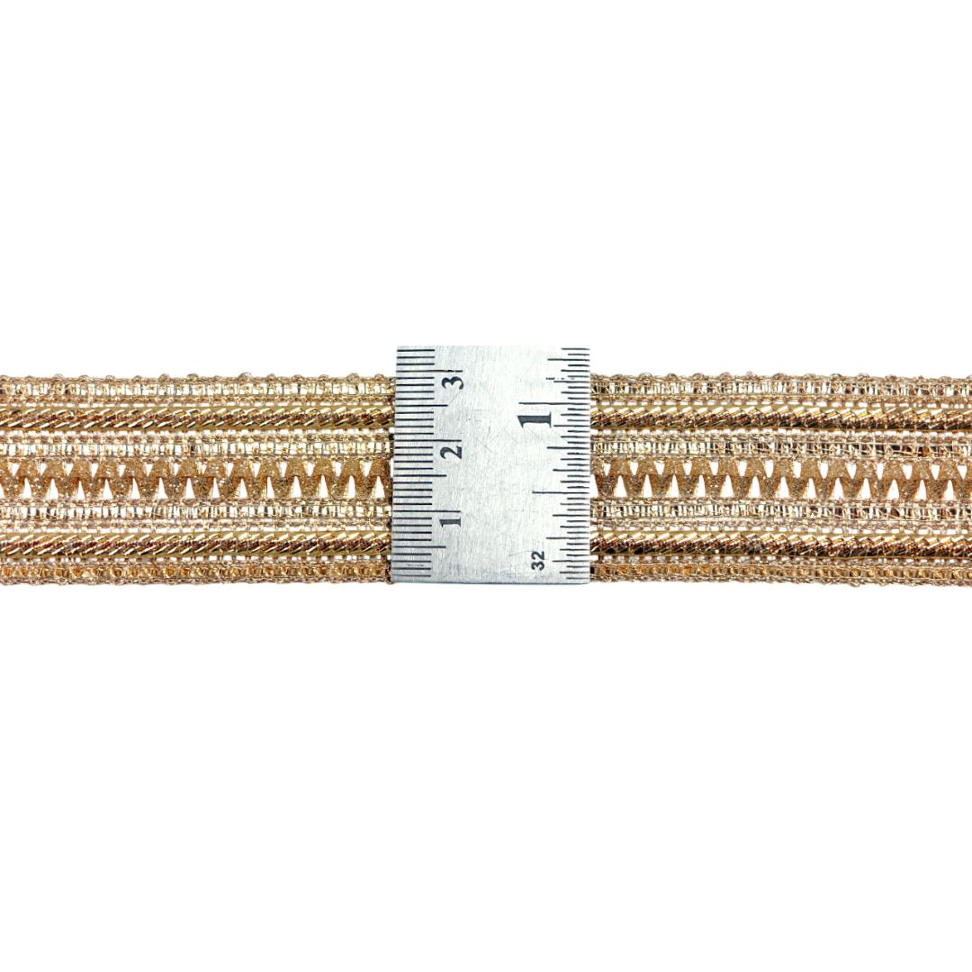 Gold braided cord with a measuring tape indicating its width on a white background