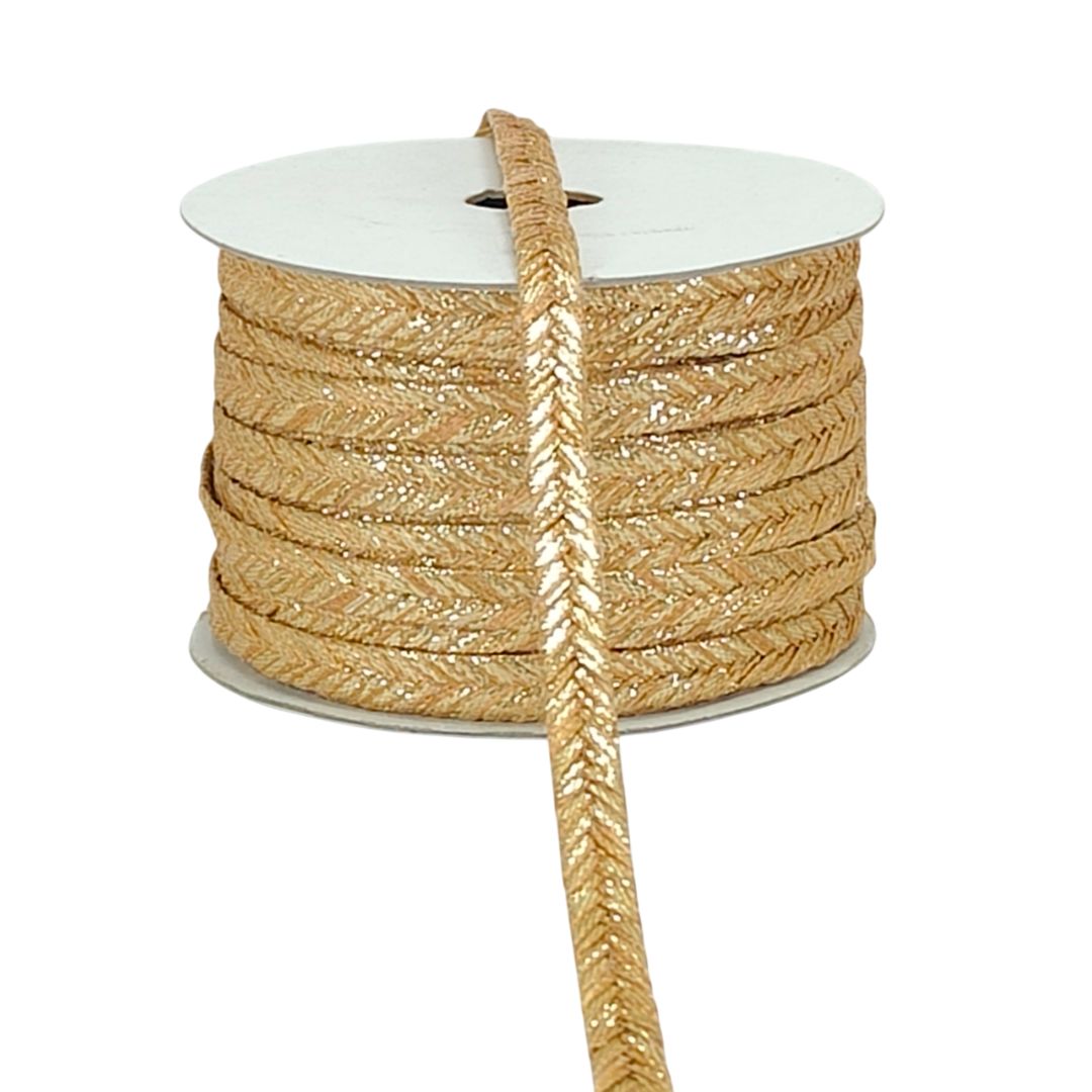 Spool of gold braided cord on a white background
