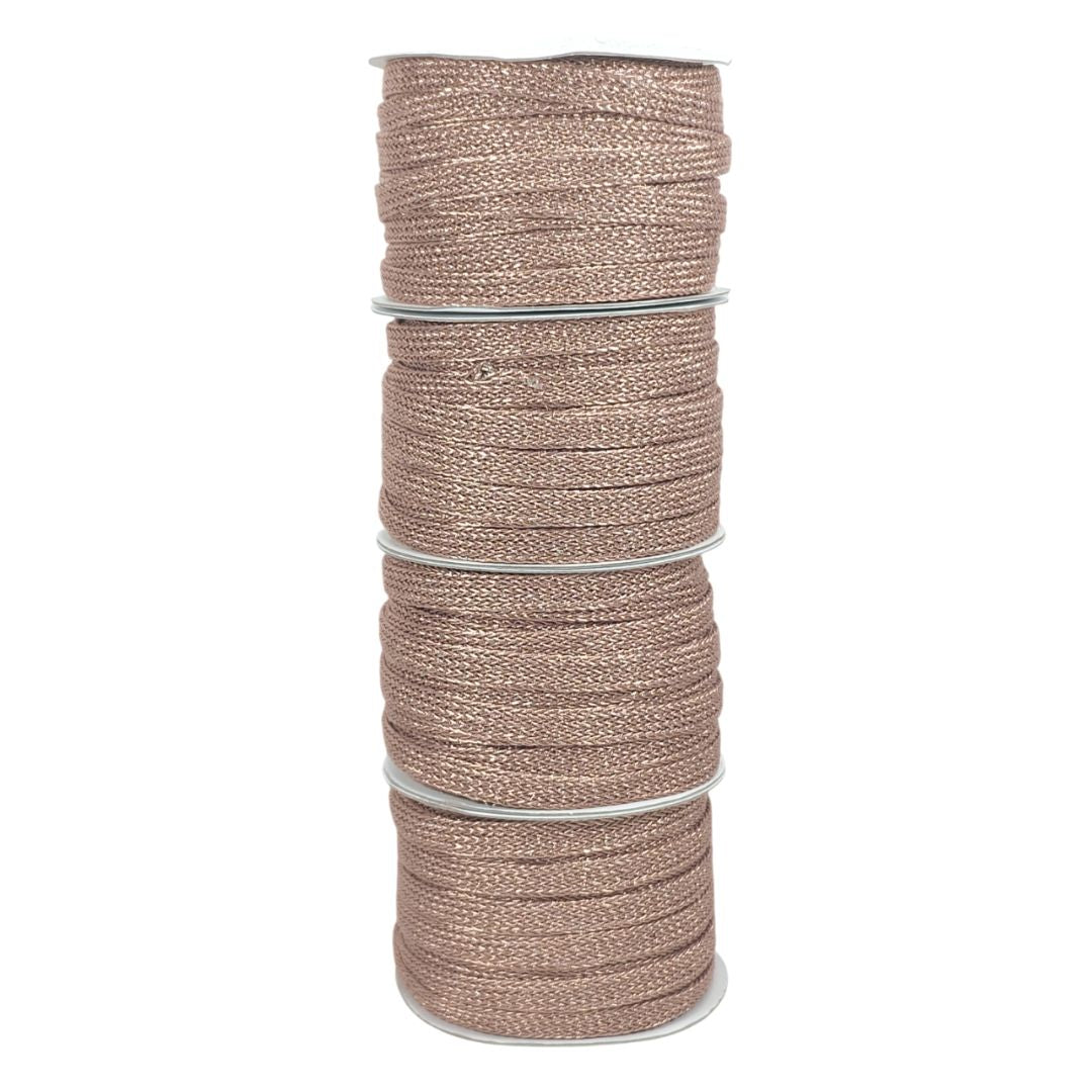 Spool of brown cord on a white background