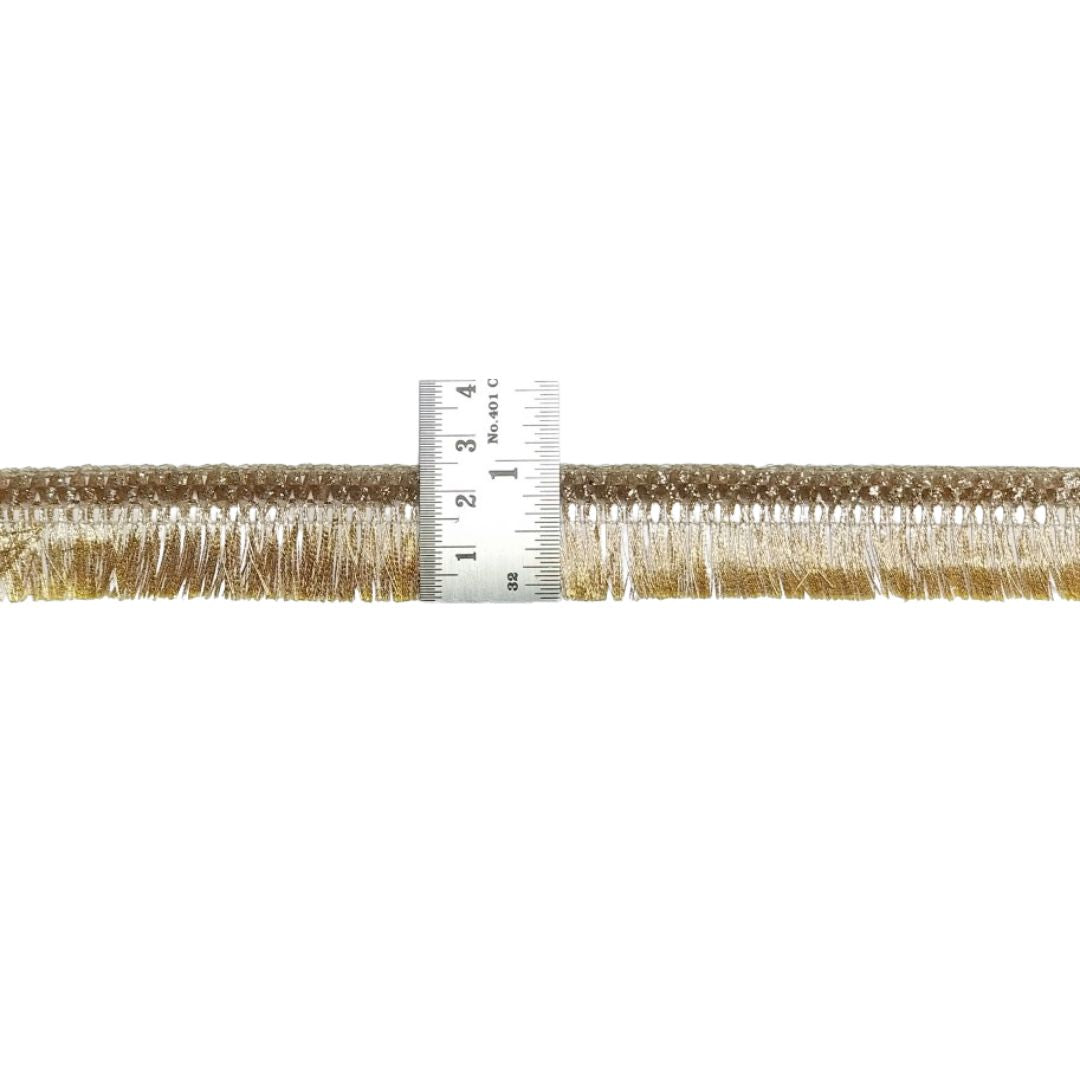 Gold fringe trim with a measuring tape on a white background