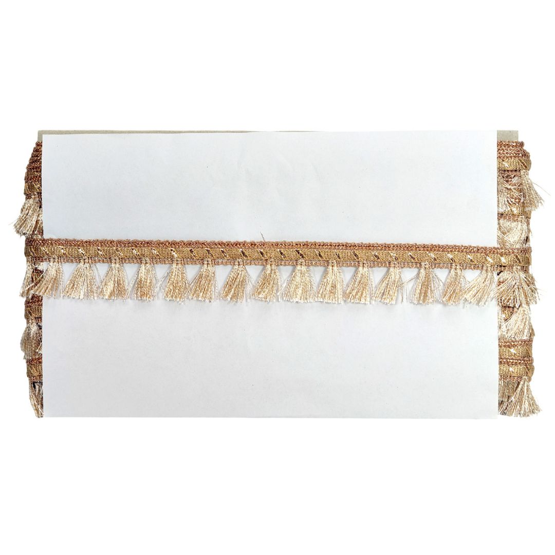 White clutch bag with gold tassel detail on a white background