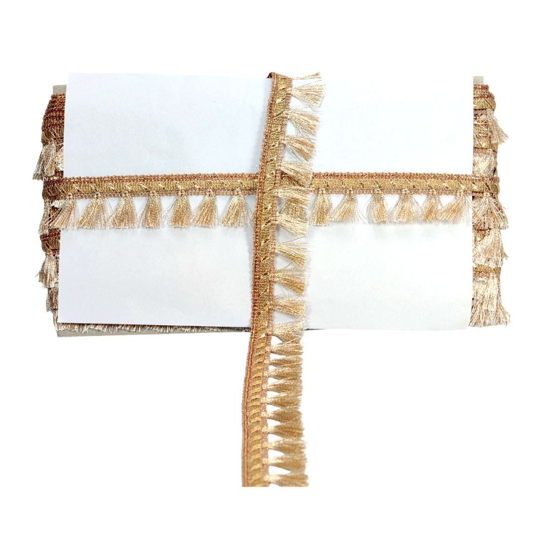 Gold fringe table runner on a white background
