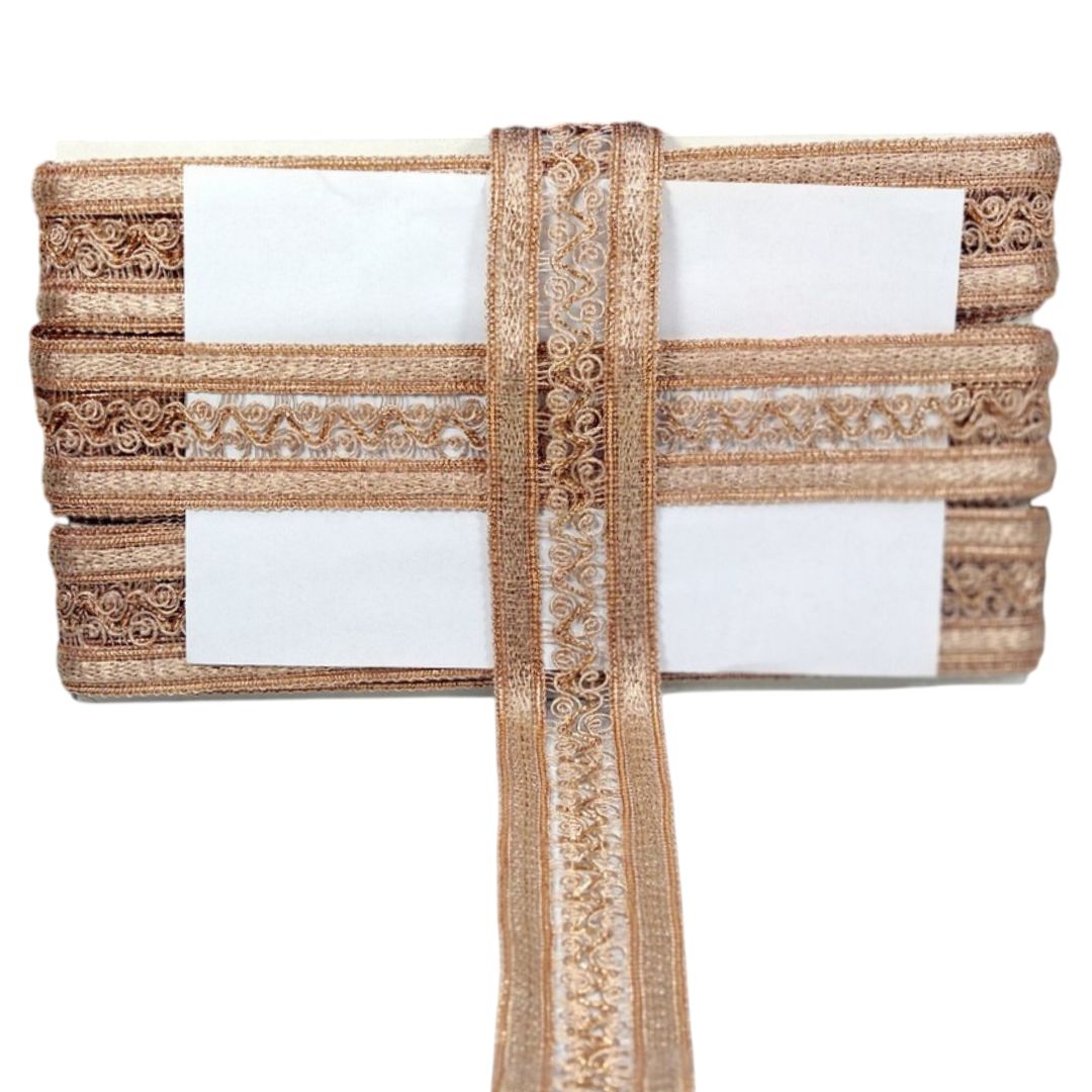 Decorative table runner with gold lace on a white background