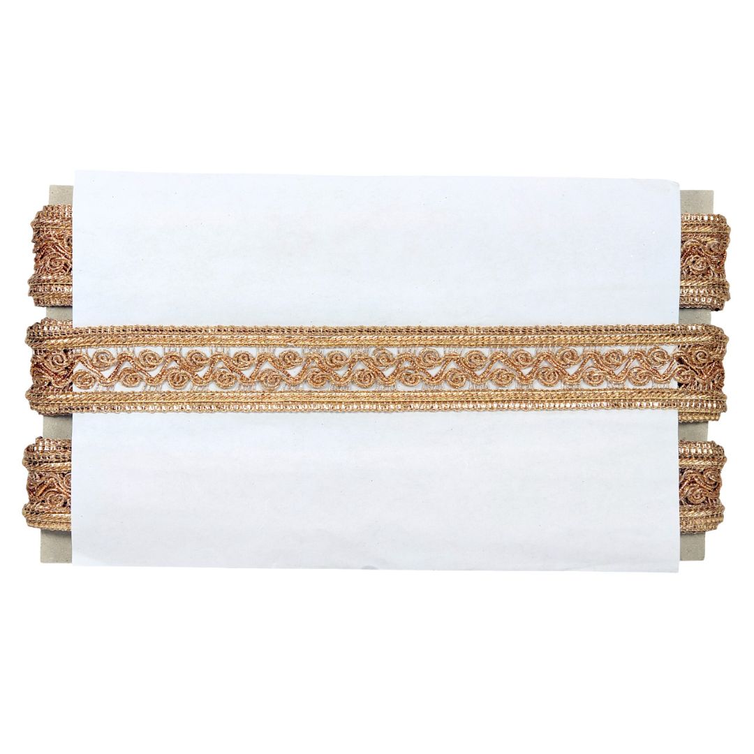 Decorative headboard with gold intricate design on a white background