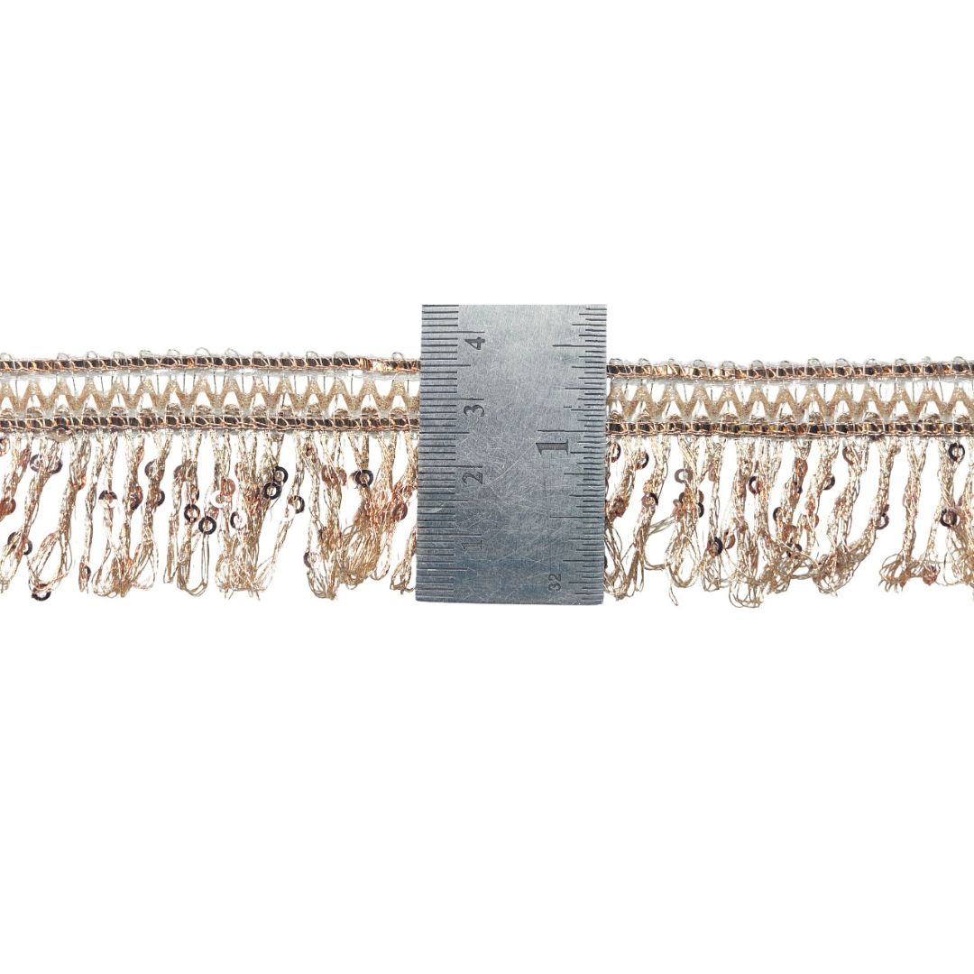 Decorative trim with a ruler for scale on a white background