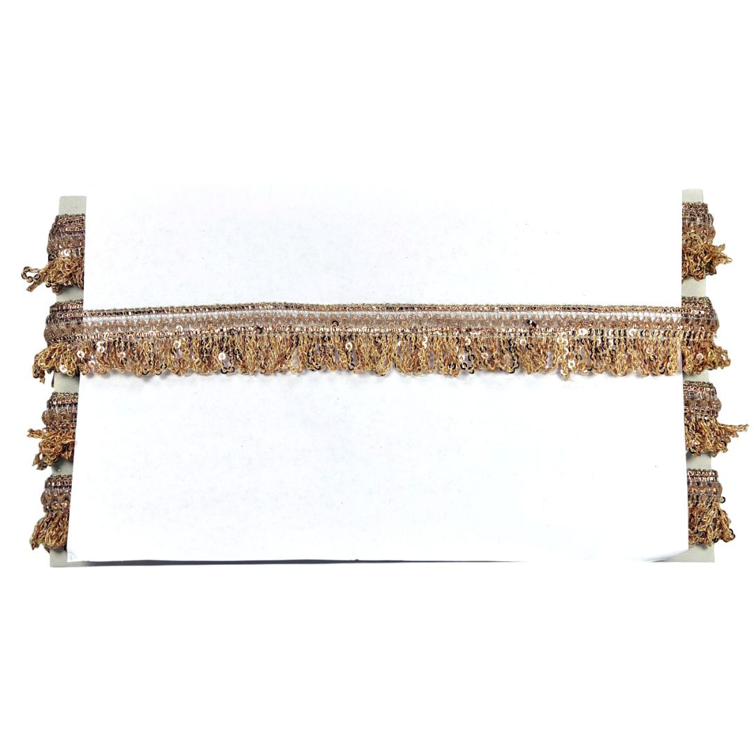 Decorative headboard with gold fringe on a white background