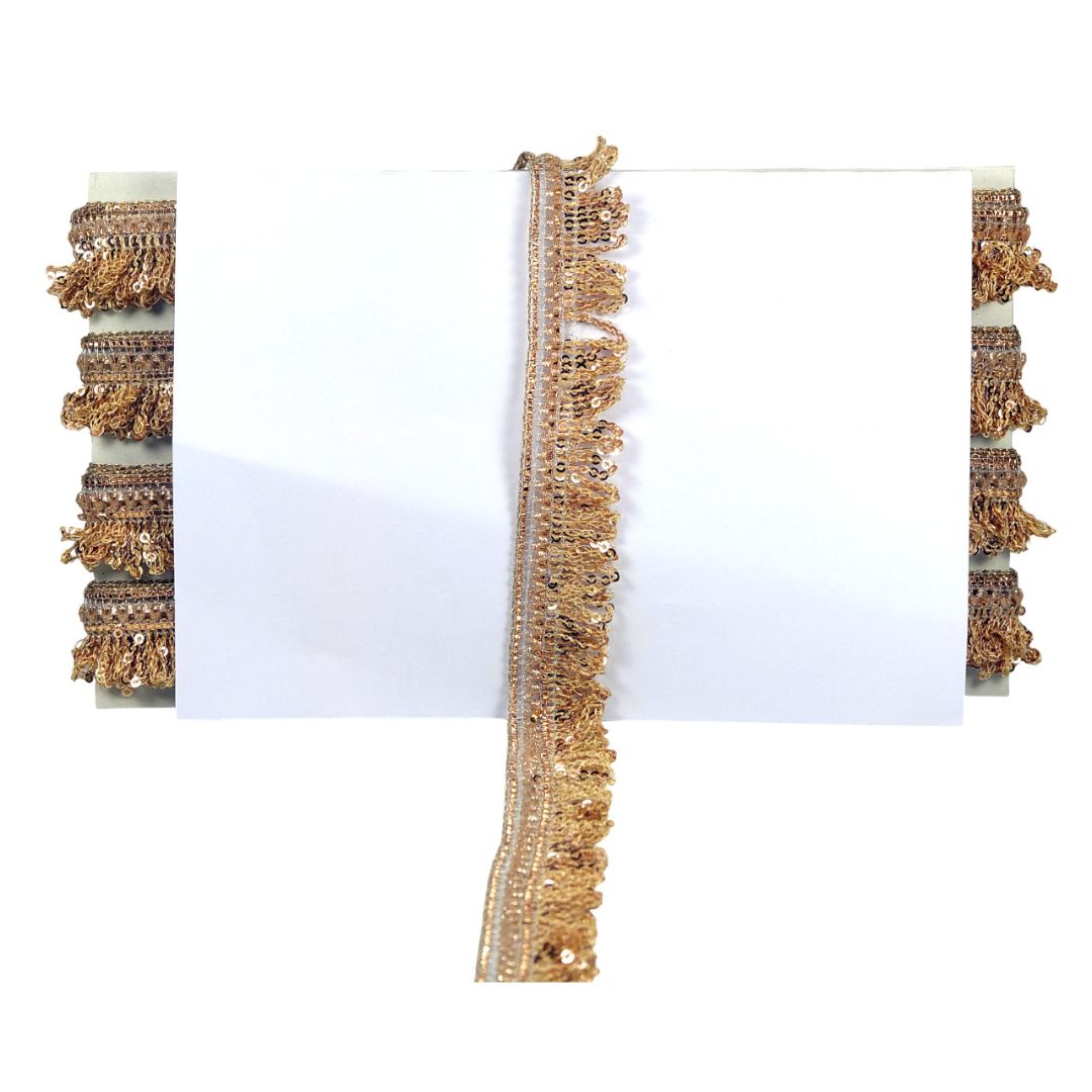 Gold fringe trim on a white background
