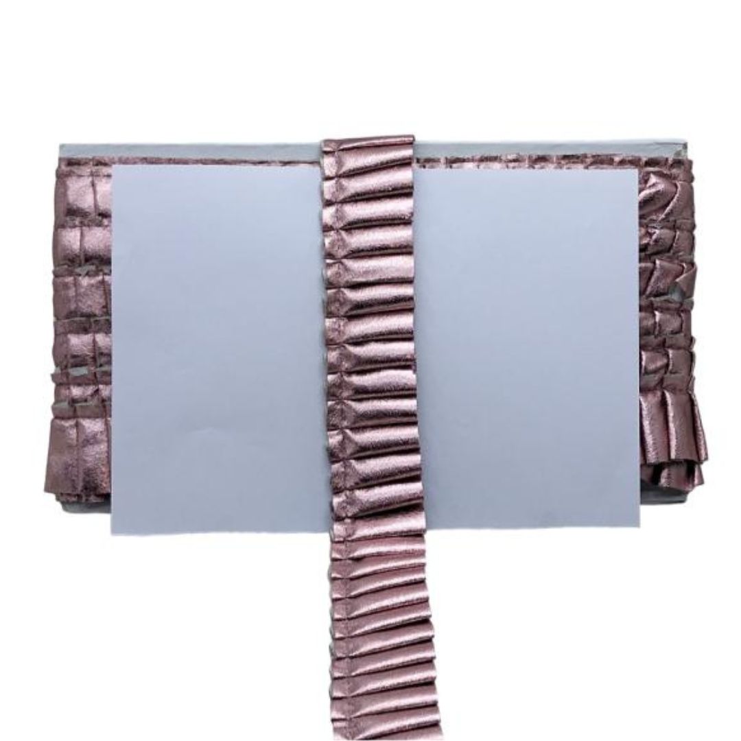 Folded fabric with textured border on a white background