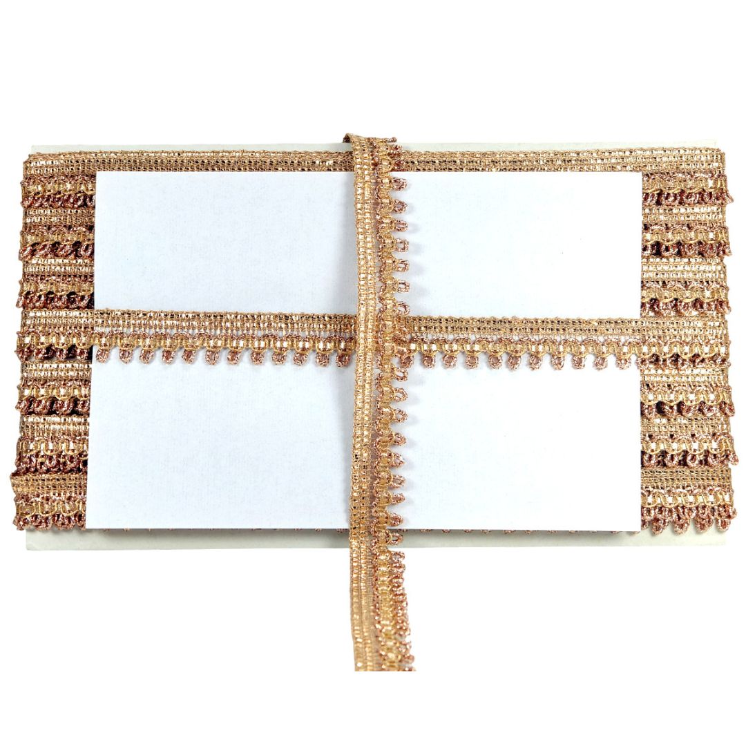Gold beaded clutch with a white interior on a white background