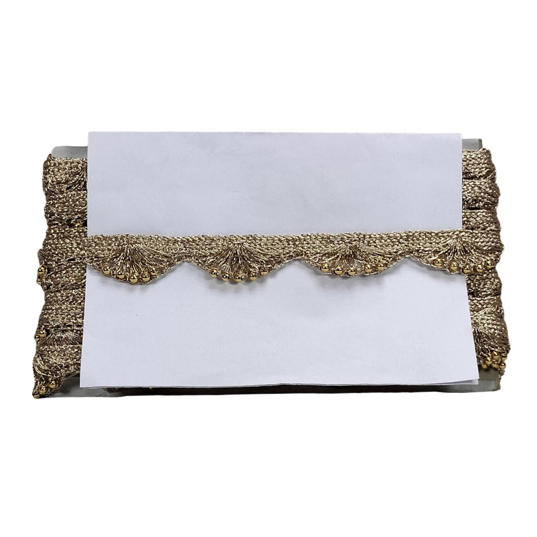 Gold clutch with a white card on a white background