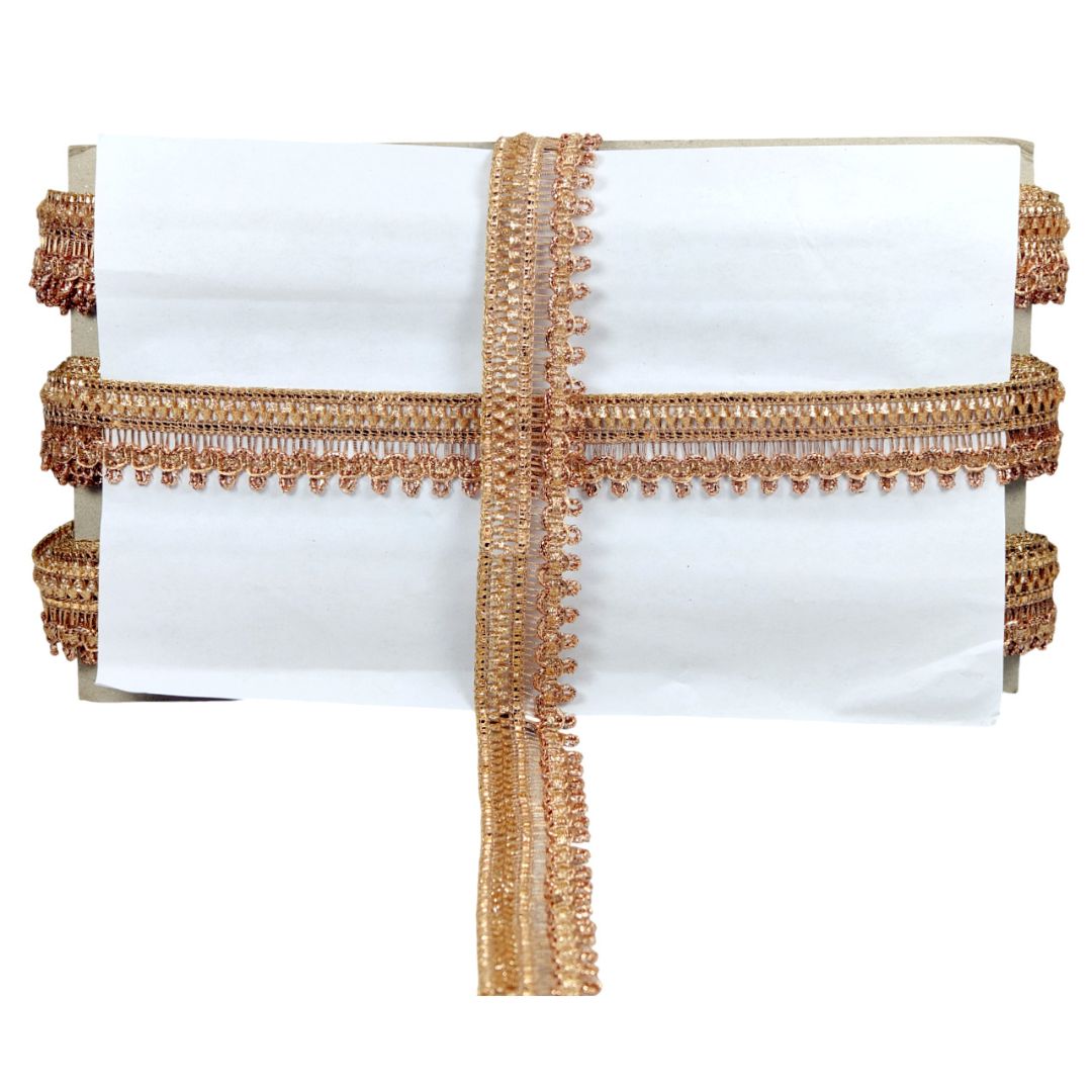 White cushion with gold decorative trim on a white background