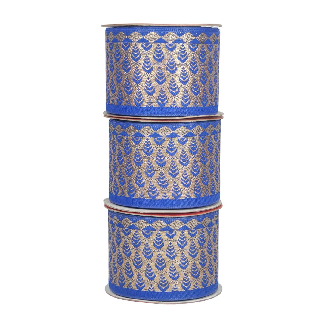 Three cylindrical containers with blue and gold patterned lids on a white background