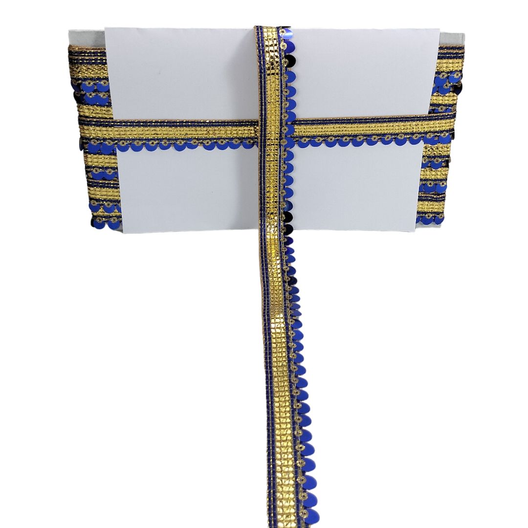 Decorative fabric strip with blue and gold patterns on a white background