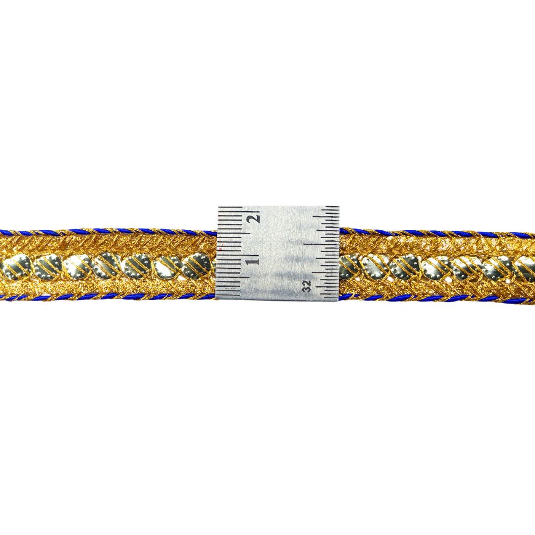 Gold and blue braided cord with a ruler for scale on a white background