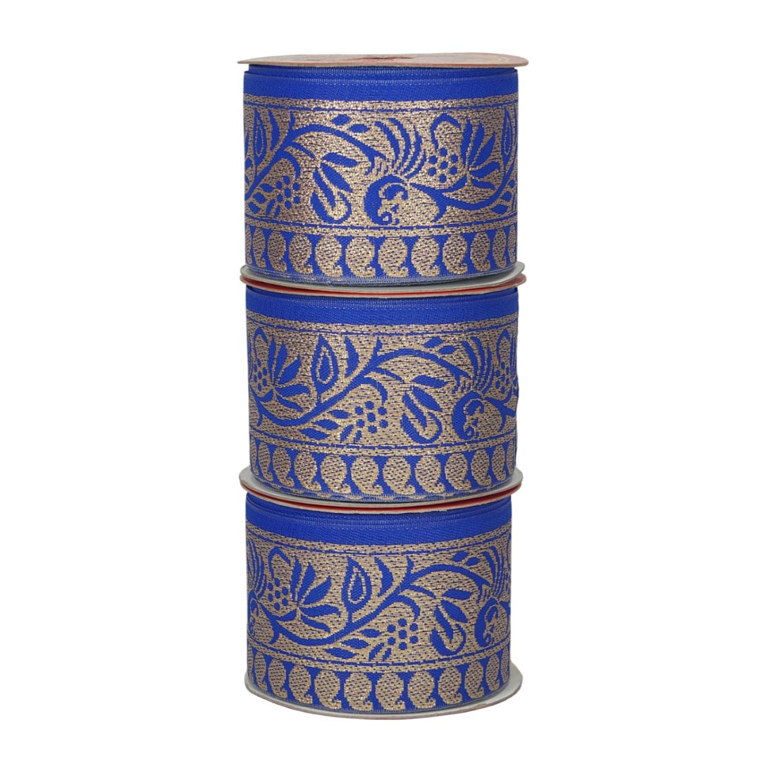 Three spools of blue ribbon with gold floral patterns on a white background