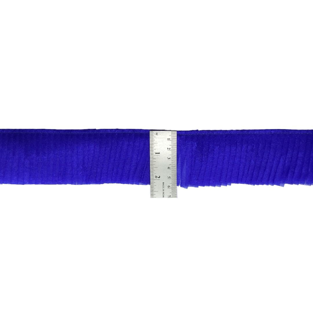 Blue ribbon with a ruler for measurement on a white background