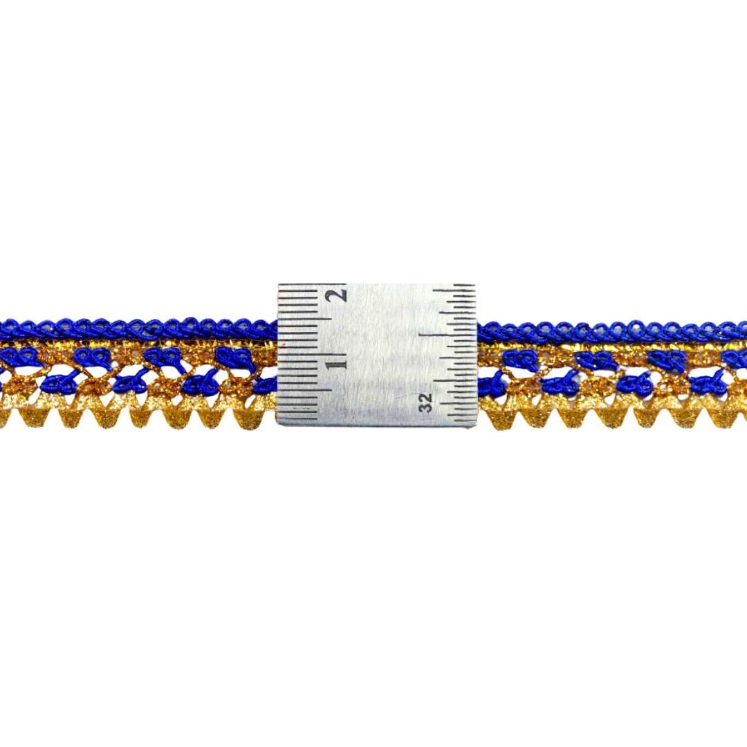 Decorative trim with blue and gold pattern next to a ruler for measurement on a white background