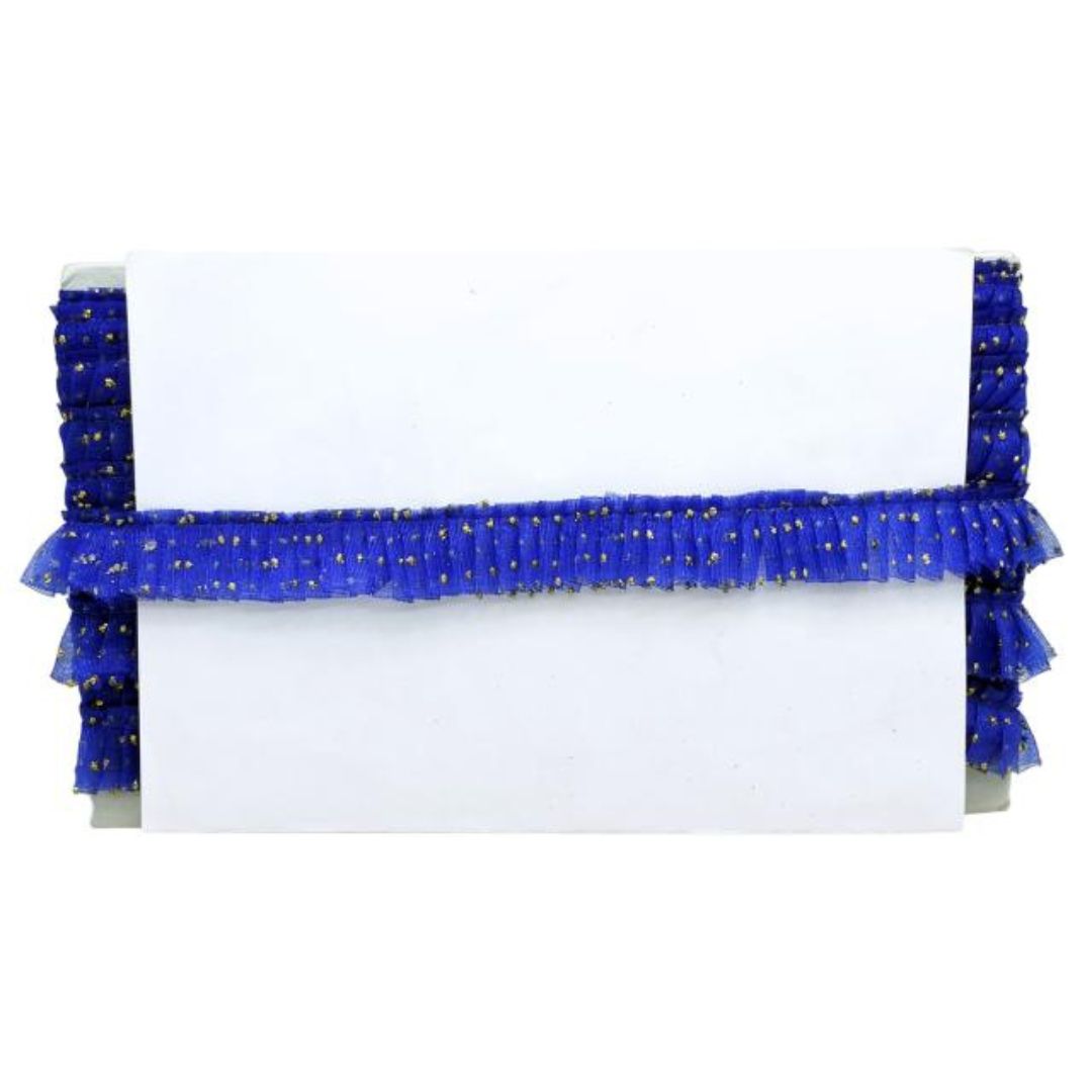 White clutch with blue beaded trim on a white background